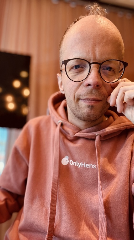 Robin Calmegård, creator of OnlyHens, in an OnlyHens hoodie